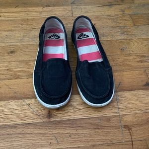 Black Roxy slip on shoes.